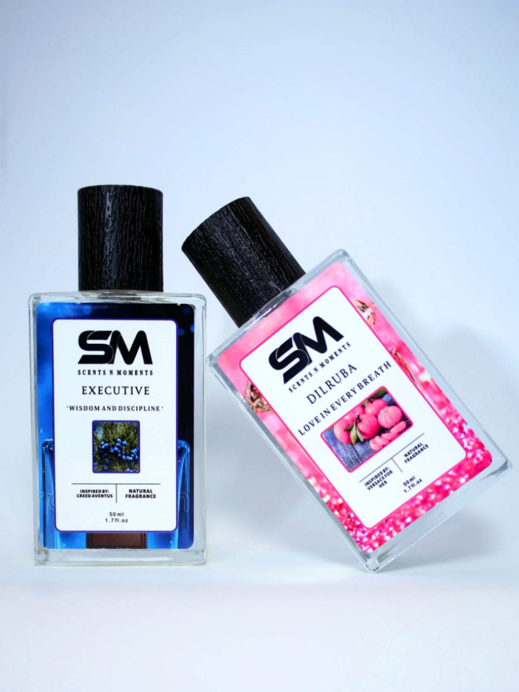 Two perfume bottles with 'SM' branding on a light gray background